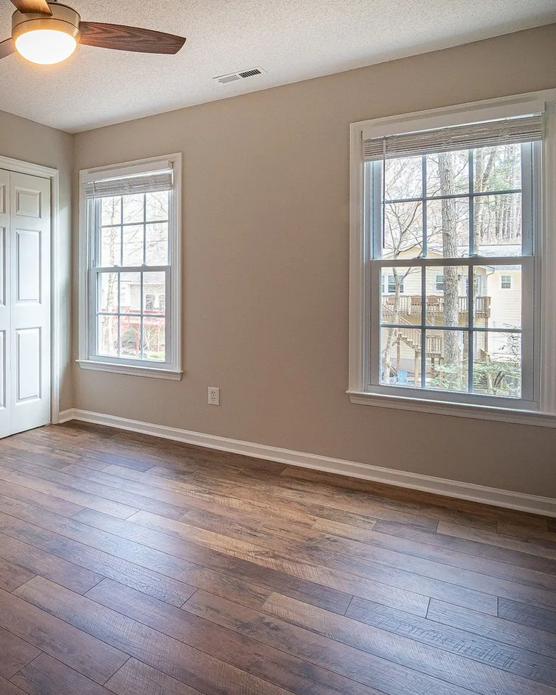 Warm laminate wood-look flooring in a Myrtle Beach bedroom