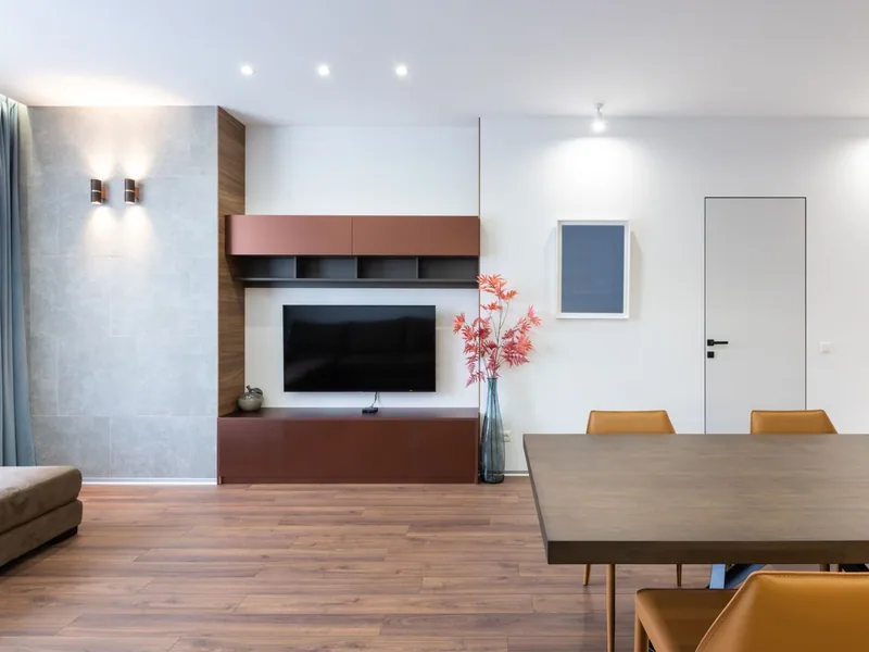 Wood-look plank tile flowing through an open living and dining area